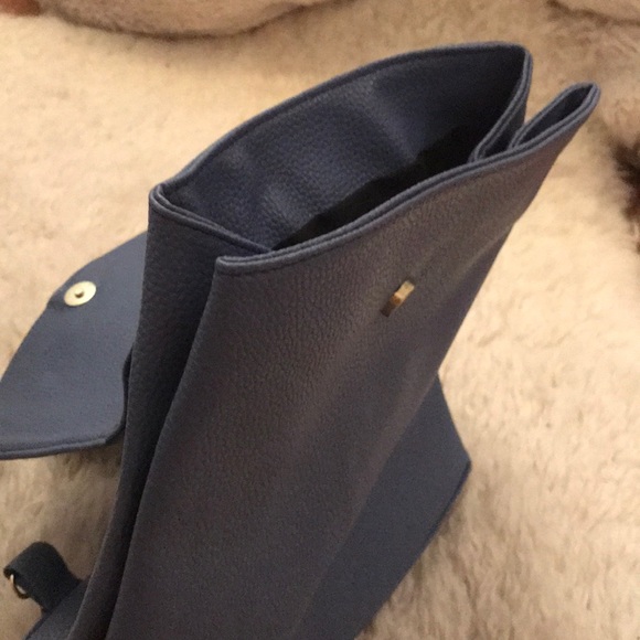 Blue pebble leather backpack with designs
